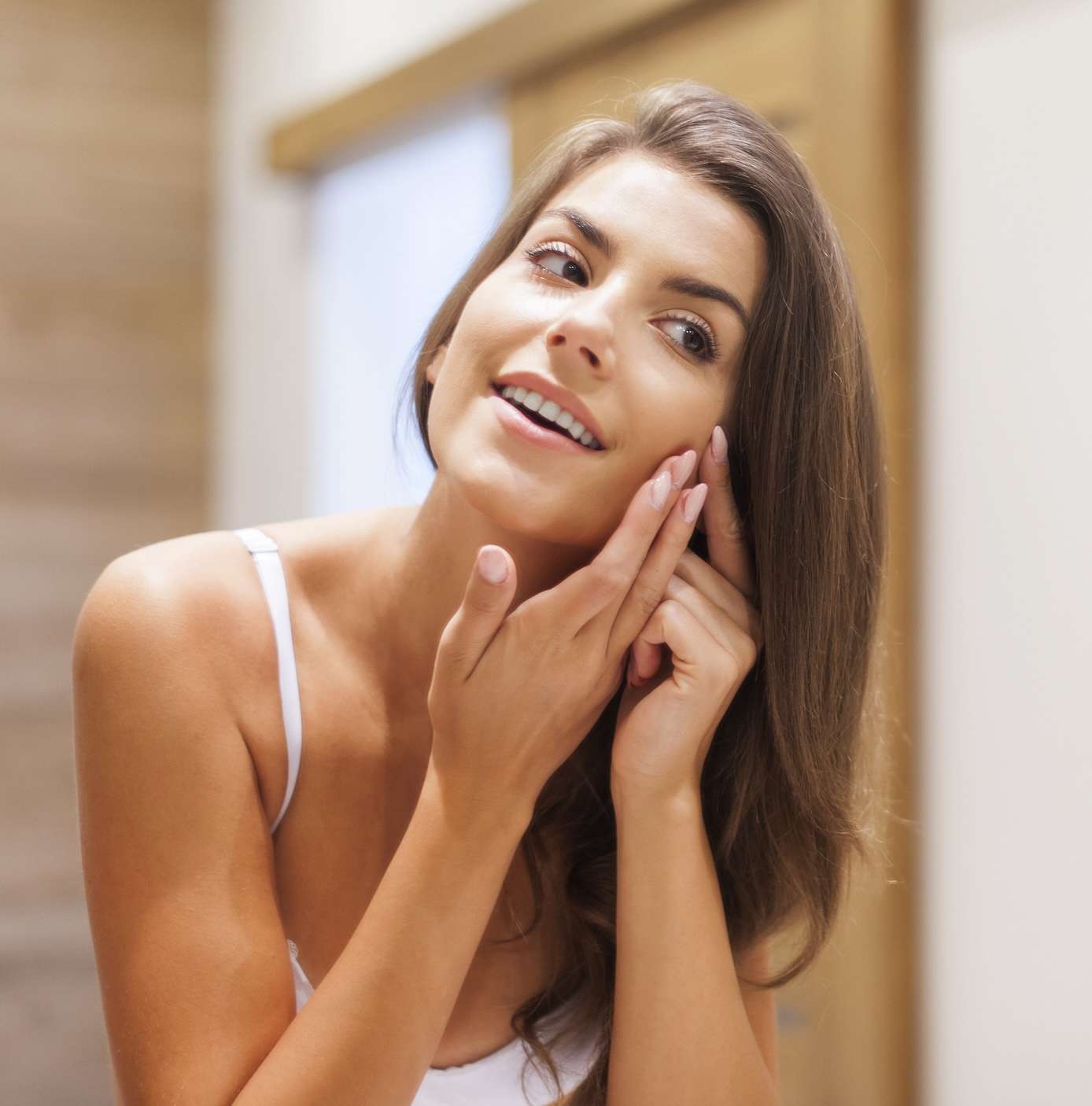 a woman touching her face